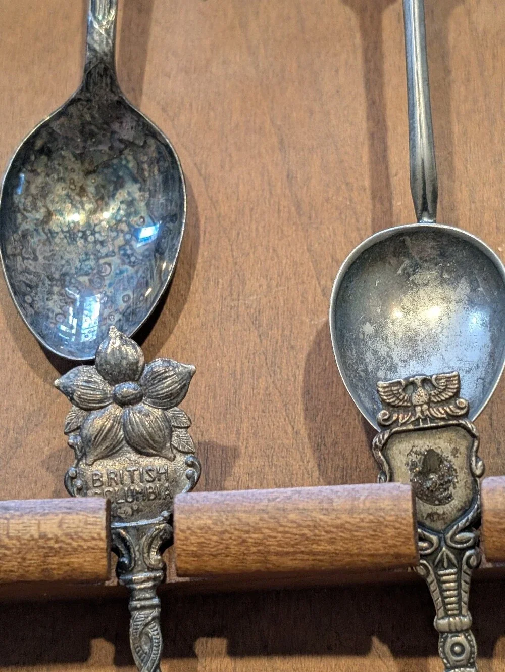 Vintage Decorative Souvenir Spoon Set on Wooden Display